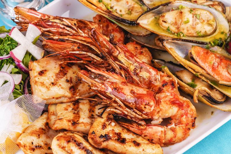 fried-fish-king-prawns-lemon-mussels-oyster-sauce-colmar-rings-crab-meat-european-cuisine-mediterranean-dish-plate-assorted-155808752